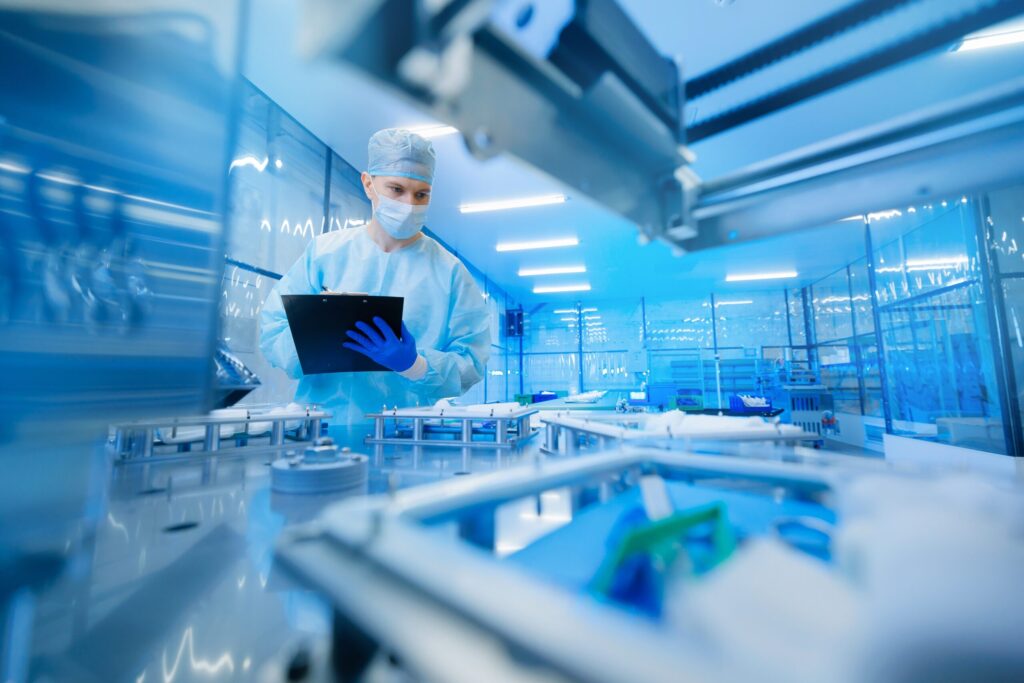 Man conducting bioprocess fluid management in laboratory 